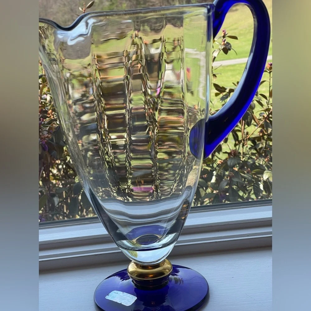 This item is a vintage, hand-blown Romanian crystal pitcher